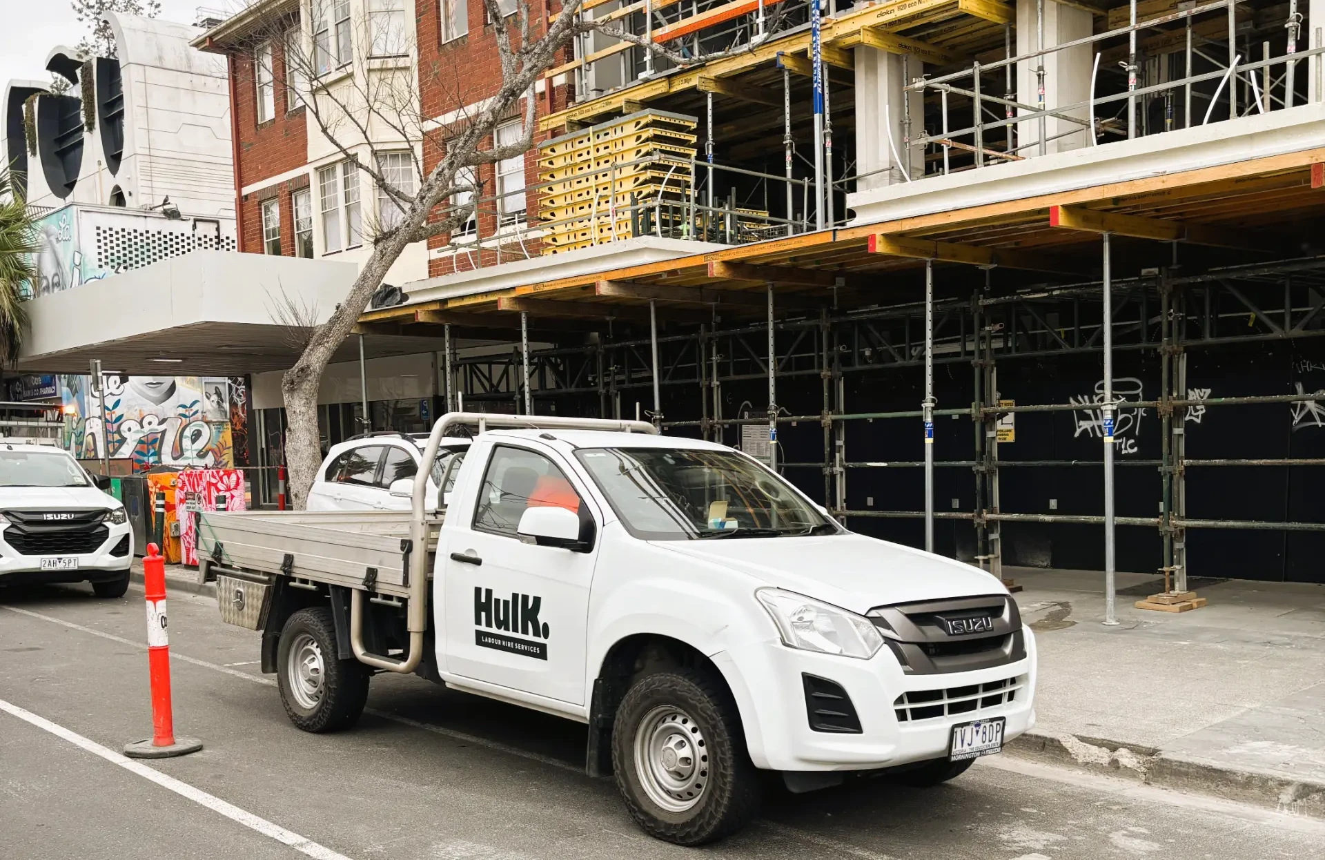 Hulk branded ute parked beside an active construction project
