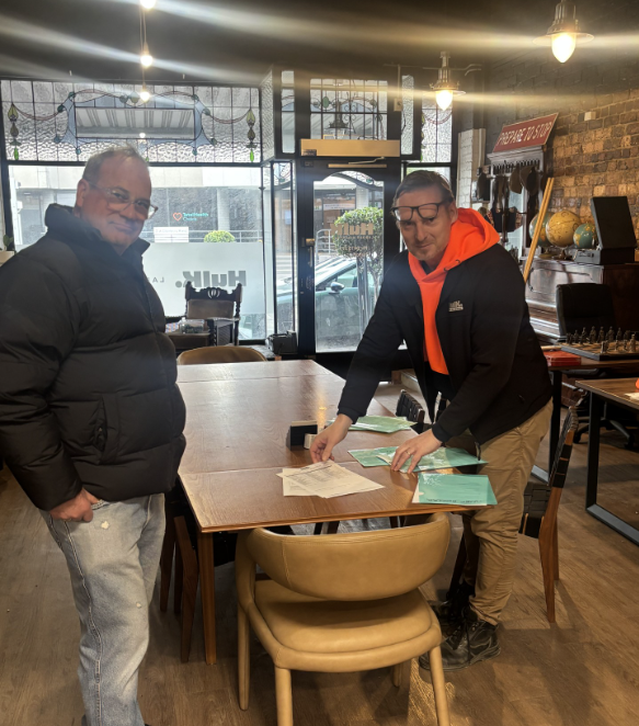 Hulk meeting with a visitor around the table at its Malvern office