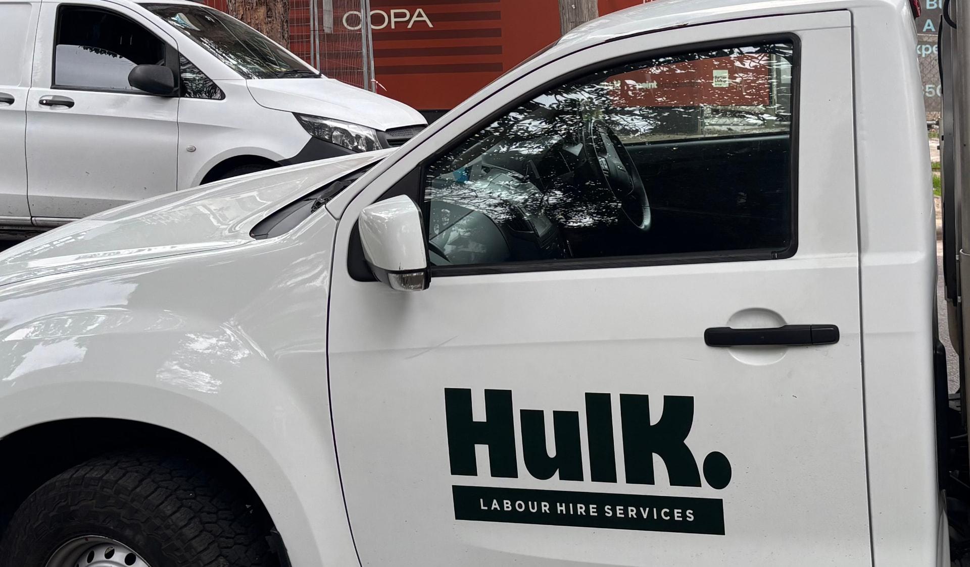 Close-up of the Hulk branded ute door with Hulk Labour Hire Services signage